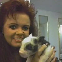 Wynter, Owner of LeatherLollipop.com and Pebbles, a pot belly pig.